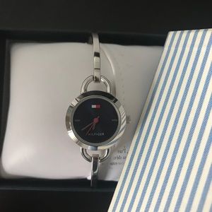 Tommy Hilfiger watch, new battery. Love it, it's just small